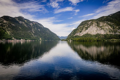 Scenic view of lake and mountains against sky