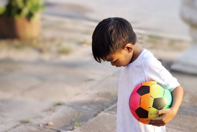 Boy playing soccer ball