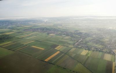 Aerial view of agricultural field against sky