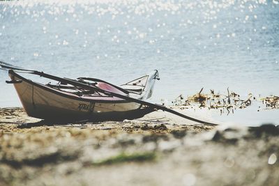 Rowboat moored at beach