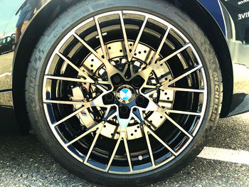 Close-up of bicycle wheel on road