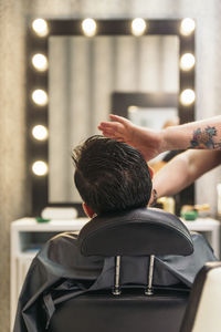 Rear view of man in barber shop