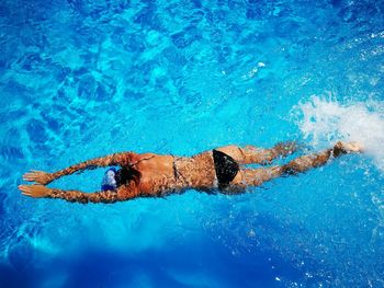 Woman swimming in pool