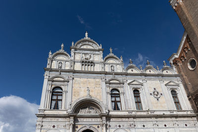 Low angle view of historic building against clear blue sky