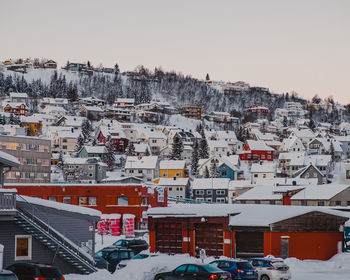 Aerial view of townscape against sky during winter