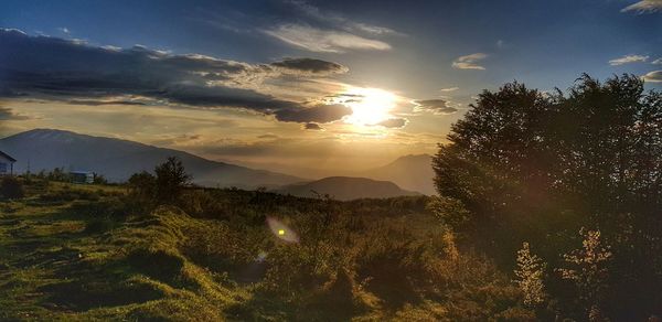 Scenic view of mountains against sky during sunset