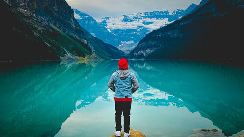 Rear view of man standing on mountain