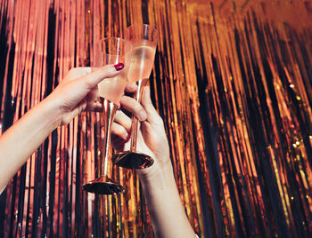 Cropped hand of woman holding wineglass