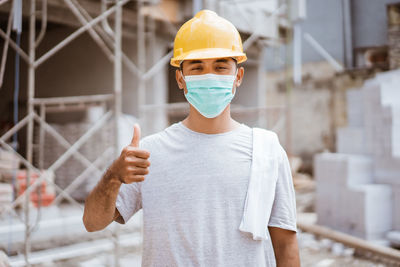 Portrait of man working at construction site