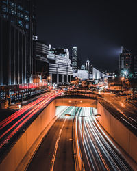 High angle view of light trails on road at night