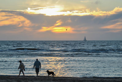 Scenic view of beach against sky during sunset