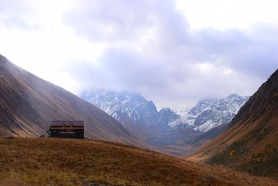 Scenic view of snowcapped mountains against sky