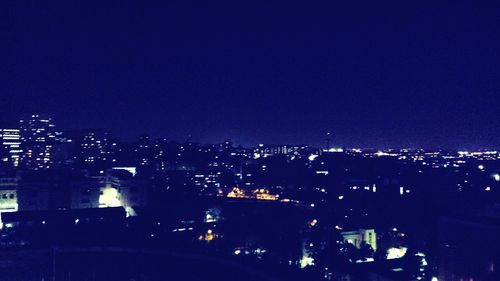 Illuminated cityscape at night