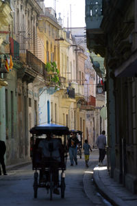 People walking on street in city