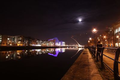 Reflection of illuminated buildings in water at night