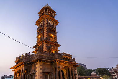 Historical clock tower ancient architecture with bright blue sky at sunset from different angle