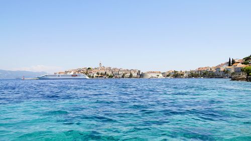 Scenic view of calm sea against clear blue sky