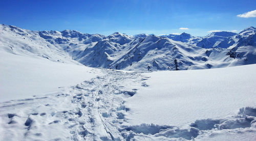 Scenic view of snowcapped mountains against sky