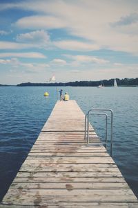 Pier over sea against sky