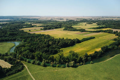 Scenic view of agricultural landscape against sky