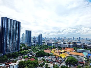 High angle view of buildings in city against sky