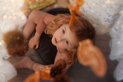 Cute girl playing with teddy bear