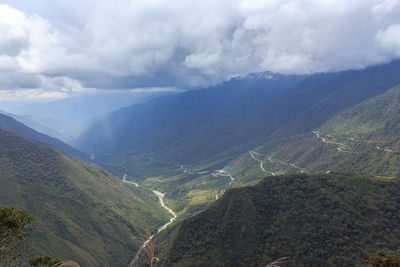 Aerial view of valley and mountains against sky