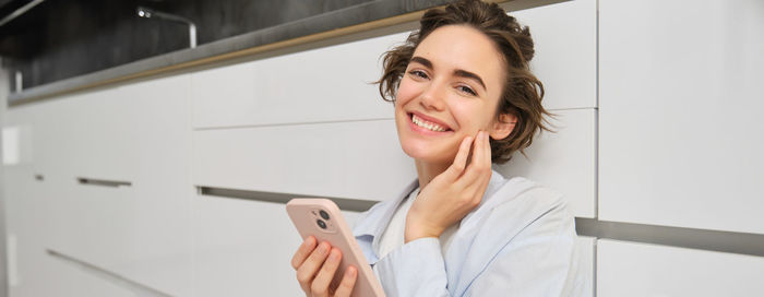 Young woman using mobile phone