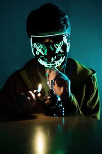 Man wearing illuminated mask