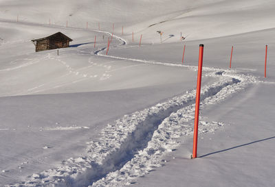 Scenic view of snow covered land