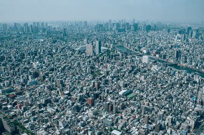 High angle view of modern buildings in city against sky