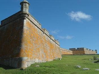 Low angle view of building against blue sky