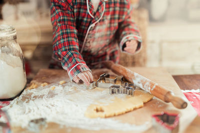 Midsection of man preparing food