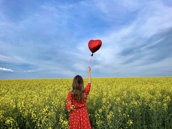 Low angle view of yellow hot air balloon against sky