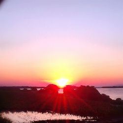 Scenic view of sea at sunset