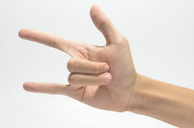 Close-up of human hand against white background