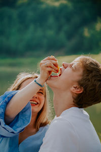 Rear view of woman holding ice cream