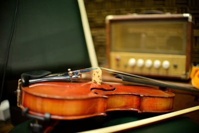 Close-up of violin and radio 