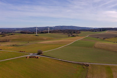 Scenic rural landscape with two wind turbines taken from the air in a natural german region