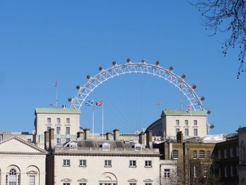 Low angle view of built structure against clear blue sky