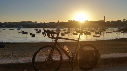 Bicycle parked in front of river