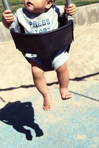 Low section of child on road