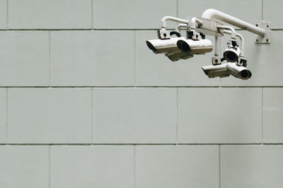 Close-up of security camera on wall