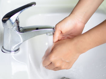 Midsection of woman in bathroom