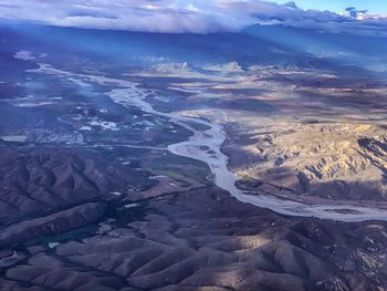 Aerial view of dramatic landscape against sky