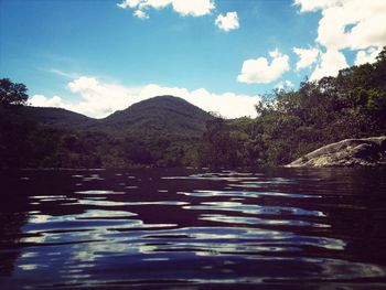 Scenic view of lake with mountains in background