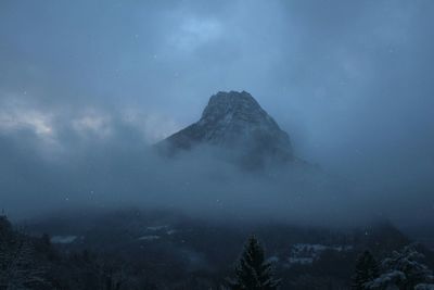 Scenic view of mountains against sky during winter