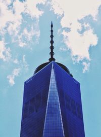 Low angle view of modern building against blue sky