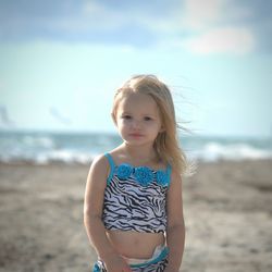 Portrait of woman standing on beach