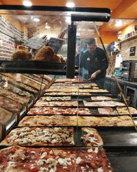 Man working on display at store